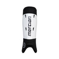 Mercian SGEV26WHT white hockey shin guards front view with integrated ankle sleeve, hard-shell shin protection and clean Mercian branding for secure high-performance coverage.